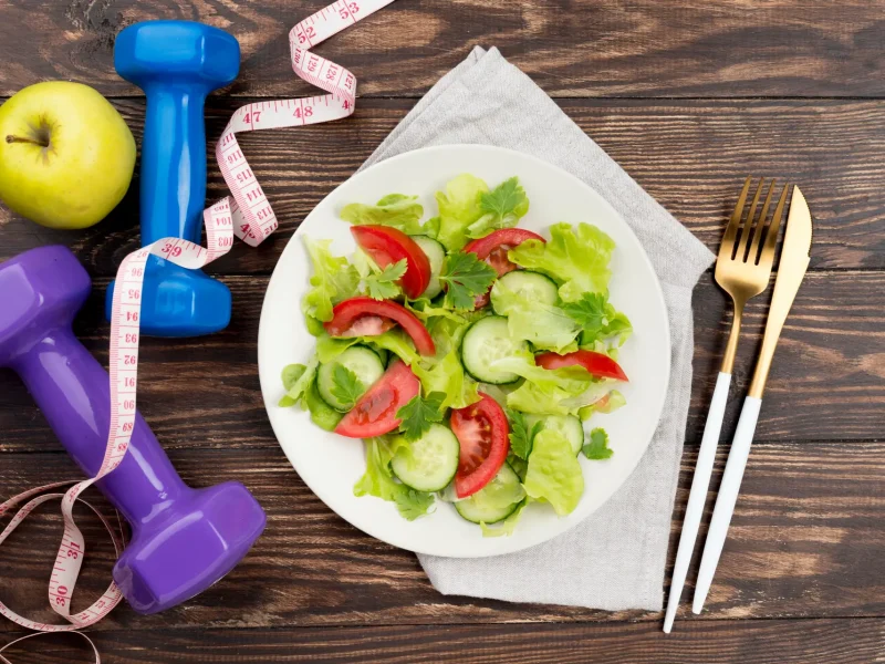 top-view-dumbbells-with-salad